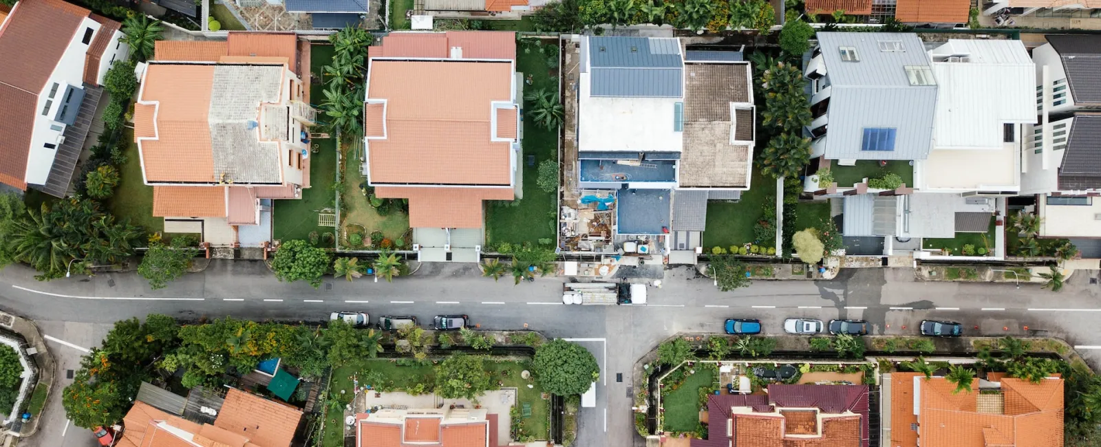 Aerial view of a neighborhood of homes with tile roofs