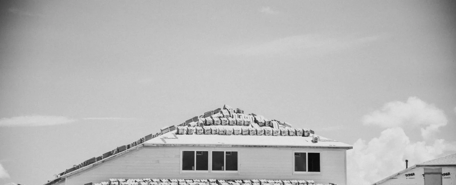 Black-and-white photo of a house roofline