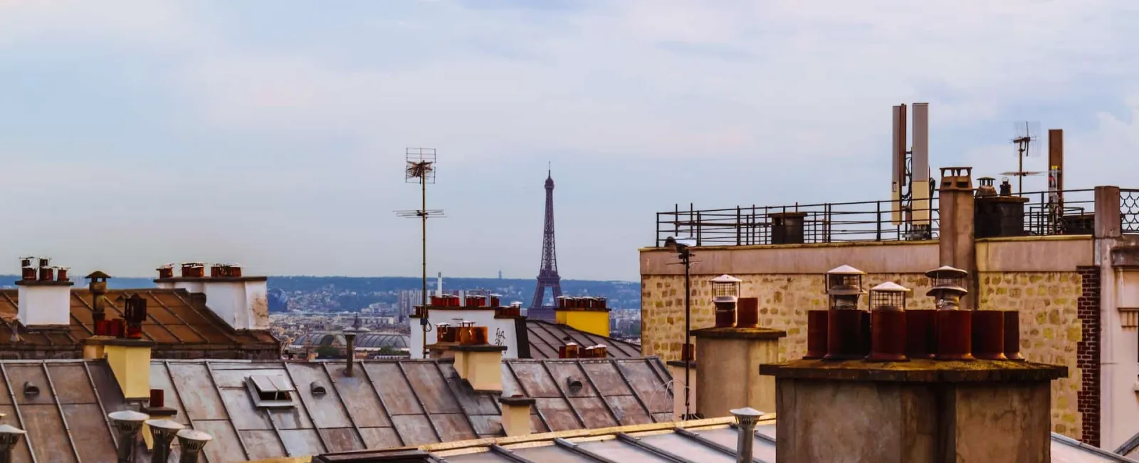 City rooftops with chimneys
