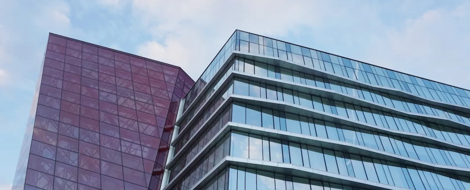 Modern glass commercial buildings against the sky