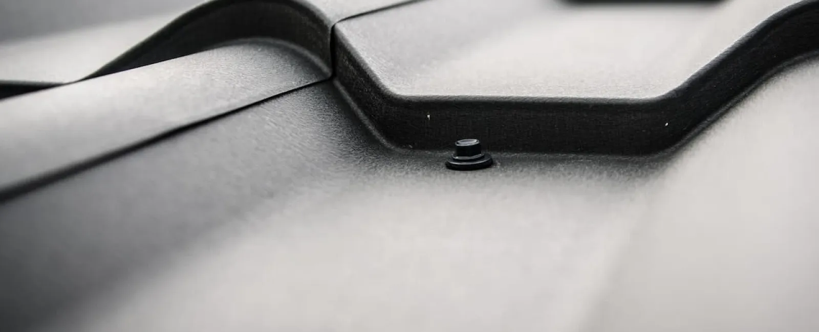 Close-up of a gray metal roof panel