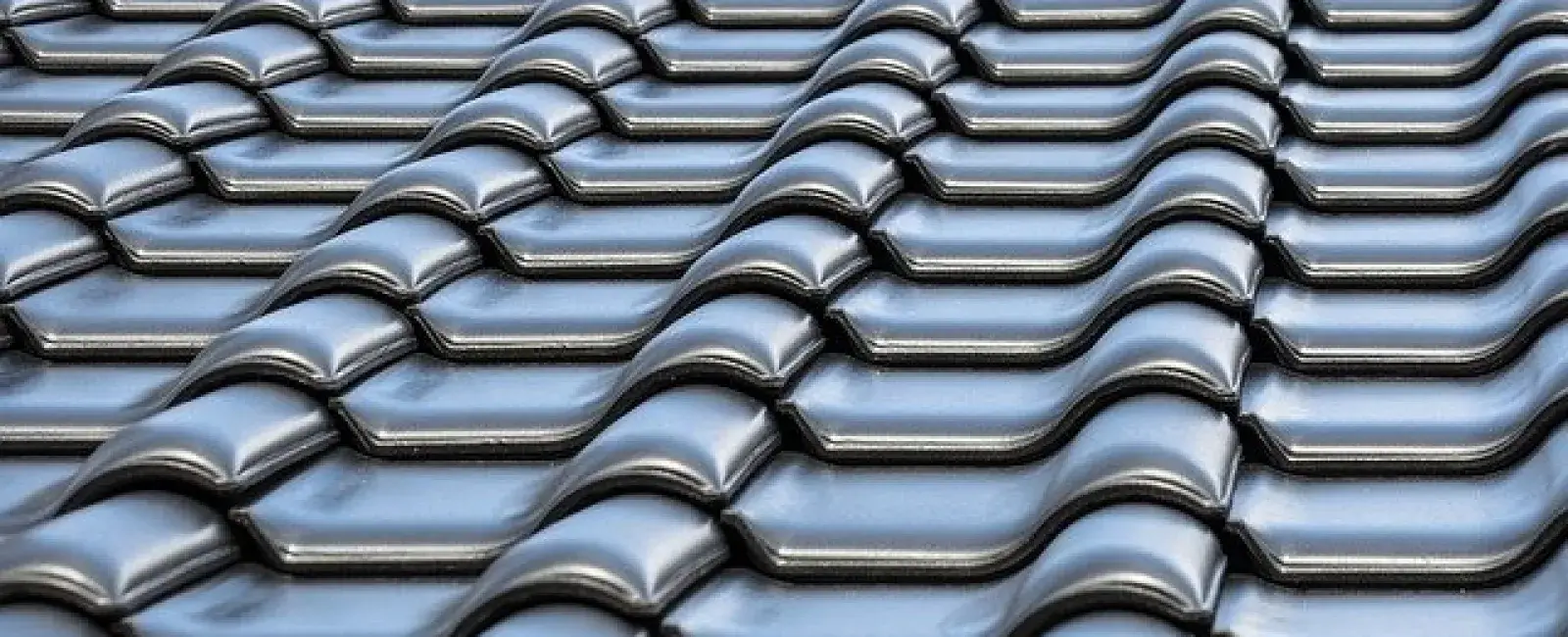 Close-up of glossy black roof tiles
