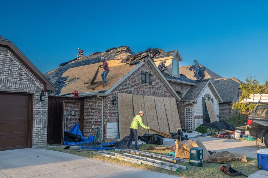 Residential roofing crew working on a roof replacement